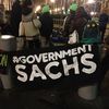 Protesters Are Camping Outside Goldman Sachs HQ Wearing Swamp Monster Masks